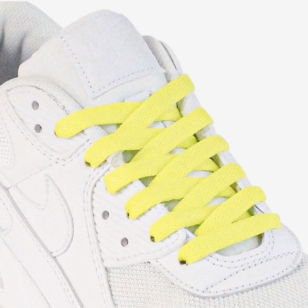 shoelace-patterns-on-womens-sneaker-using-fluorescent-yellow-laces